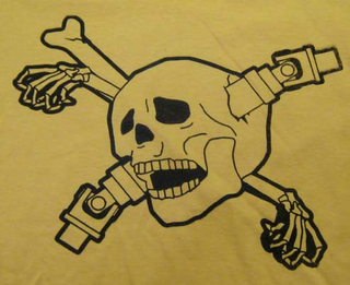 Illustration for article titled Genuine Driveshaft Through The Skull Shirts Now Available!